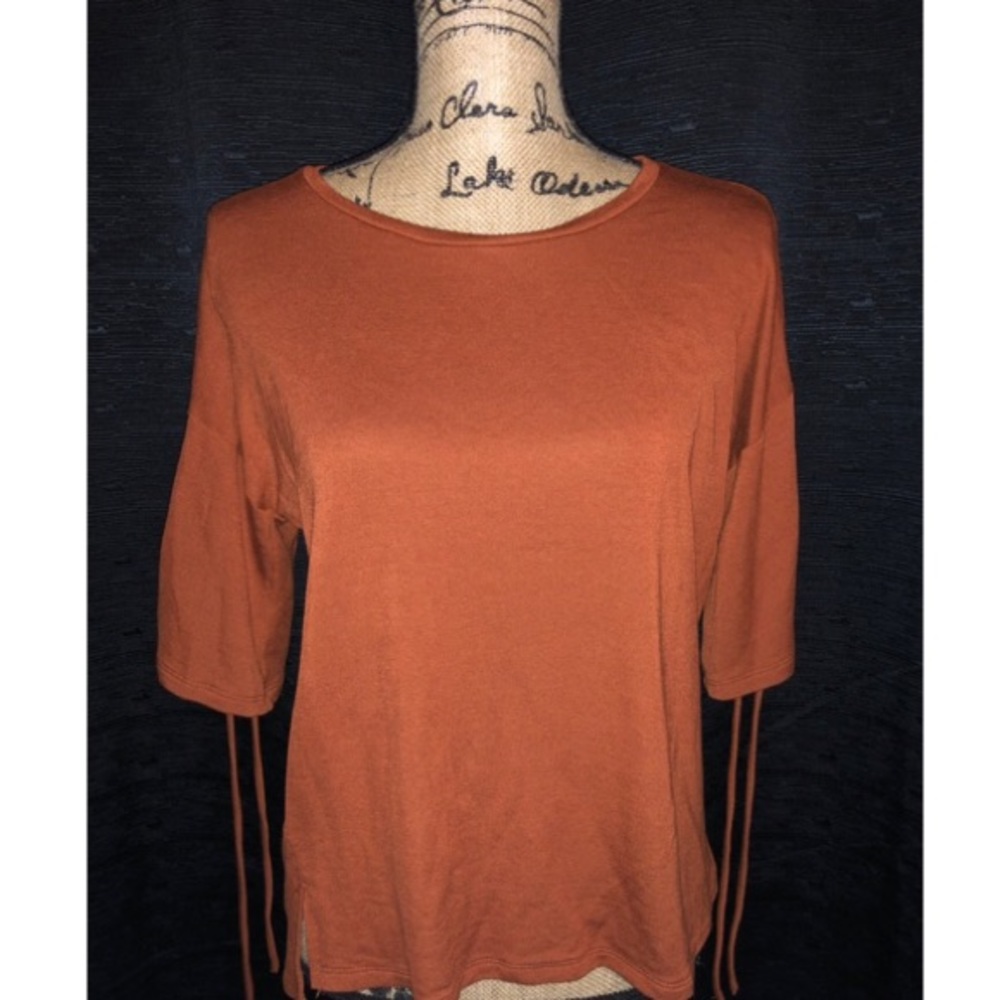 Loose scoop neck blouse with tied sleeves
